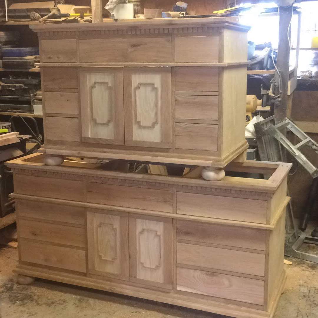 Custom white oak double vanity in-progress with dental molding and inset cabinetry by The Stockton Mill.